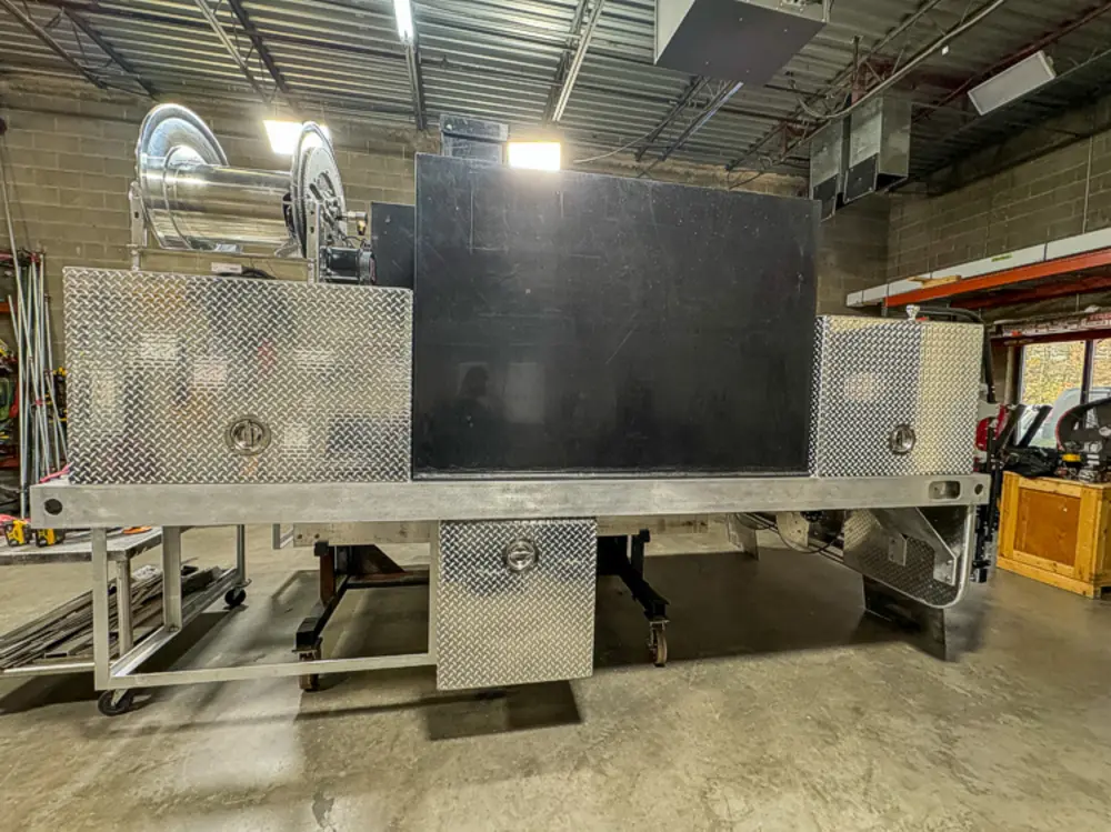 Engine and hose connection hardware detail, photo 129 of 303.